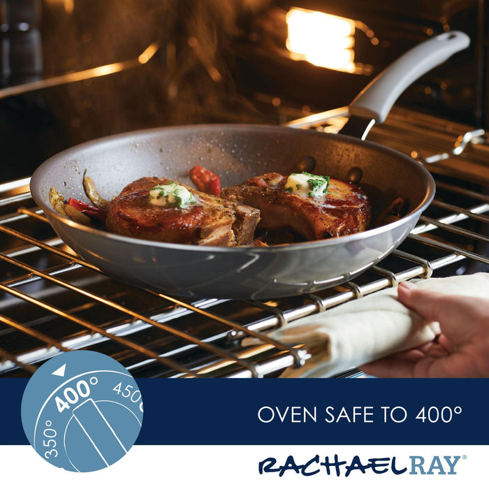 Pork chops sizzle in one of the 2-Piece Cook + Create Nonstick Frying Pans inside the oven, set perfectly at 400°F.