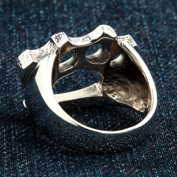 Back view of knuckle duster ring revealing inner construction and 925 stamp area