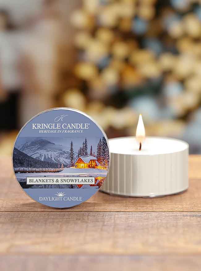 Kringle Candle daytime candle with packaging on a wooden surface