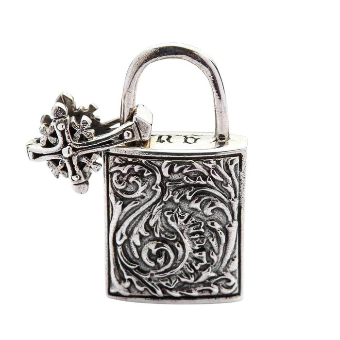 Reverse side of the silver padlock pendant revealing intricate swirl engravings, with the Celtic bail tilted to the left.
