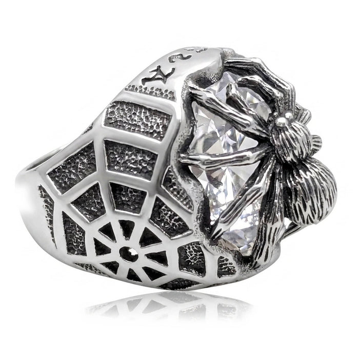 Side profile showing the oxidized spider-web pattern spanning the band beside the clear stone setting