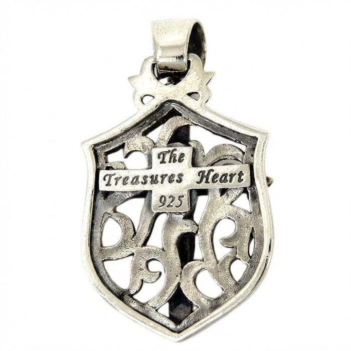 Back of crucifix shield pendant showing 925 sterling silver hallmark stamp and The Treasures Heart maker mark