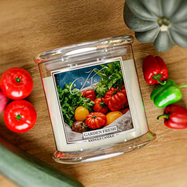 Kringle Candle jar labeled "Garden Fresh" with an image of tomatoes and greens on the front.