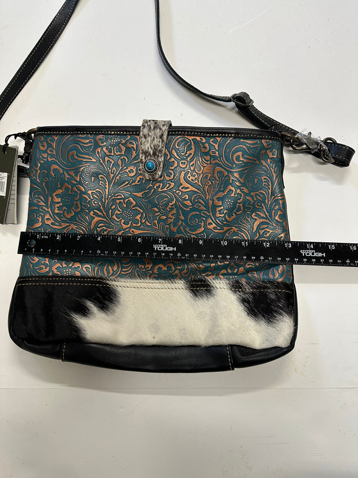 Myra turquoise and black cowhide leather hand bag with tooled leather.