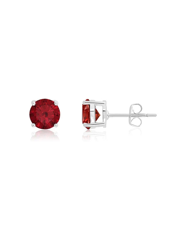 A pair of stud earrings with a red gemstone in a platinum finish, displayed against a white background.