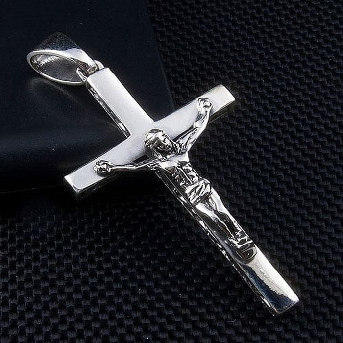 Detailed view of men's solid 925 sterling silver crucifix pendant with Jesus figure on high-polish cross