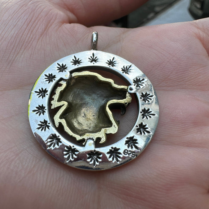 Back of the Rasta Lion pendant showing cannabis leaf stamps around the sterling silver ring and the .925 hallmark