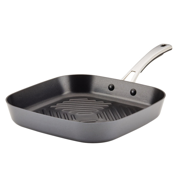 The 11-Inch Cook + Create Hard Anodized Nonstick Deep Grill Pan by Rachael Ray features a ribbed surface and metal handle, crafted from hard anodized aluminum for durability.