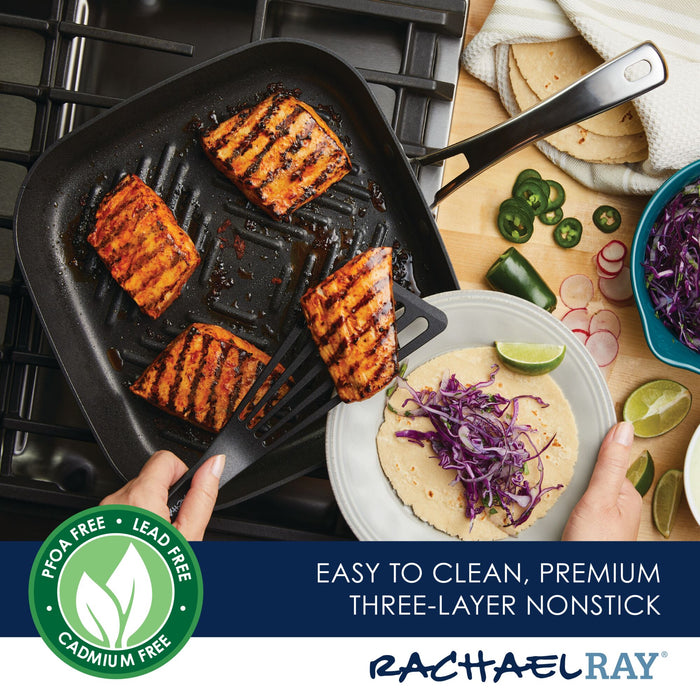 Grilled salmon sizzles in an 11-Inch Cook + Create Hard Anodized Nonstick Deep Grill Pan, paired perfectly with tortillas, lime, and crunchy cabbage on the side.