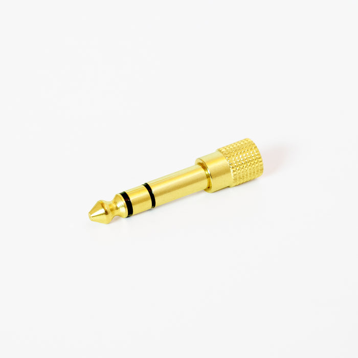 Gold 1/4" Adapter on a white background