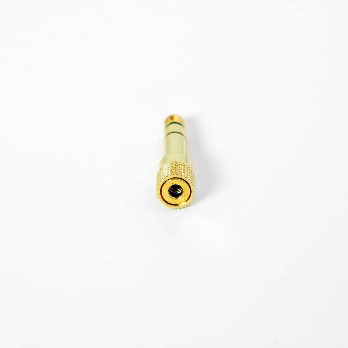 Gold 1/4" Adapter on a white background