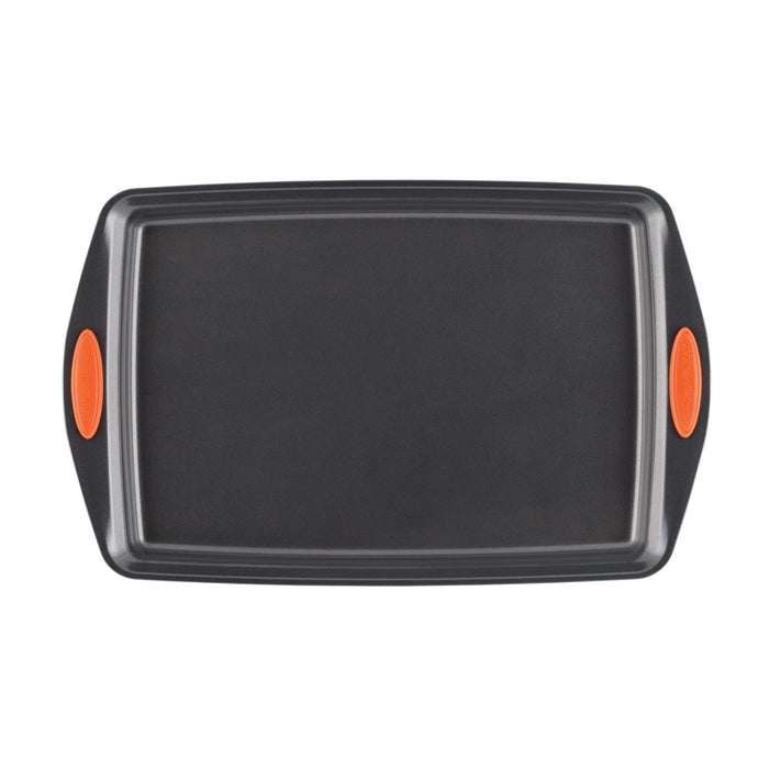 The 4-Piece Nonstick Sheet Pan and Turner Set, featuring a rectangular baking pan with orange handles, is designed for effortless cooking. This oven-safe sheet is also dishwasher-safe for easy cleanup when viewed from above.