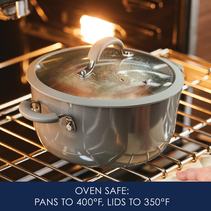 5-Quart Cook + Create Nonstick Dutch Oven with Lid in gray, placed in the oven. Text reads: "Oven safe: Pans up to 400°F, lids up to 350°F." Ideal for stove-to-oven recipes.