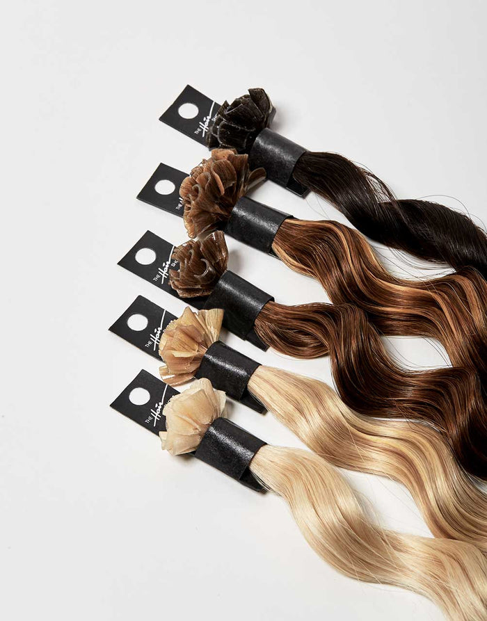 row of bundles of 808 exclusive Keratip® extension in a variety of colors