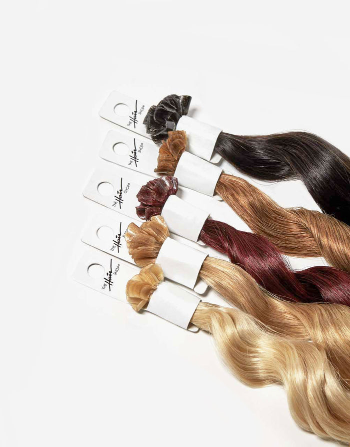 row of bundles in 808 keratip extensions in a variety of colors