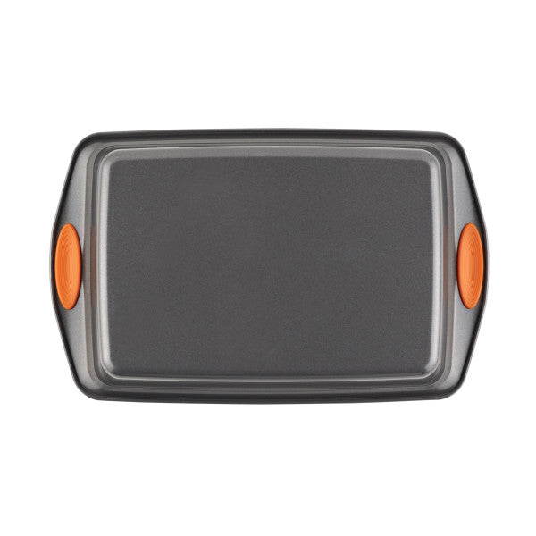 The 9-Inch x 13-Inch Nonstick Rectangle Roasting & Cake Pan is crafted from heavy gauge steel and showcases vibrant orange handles on a white background, making it ideal for stylish, oven-safe cooking.