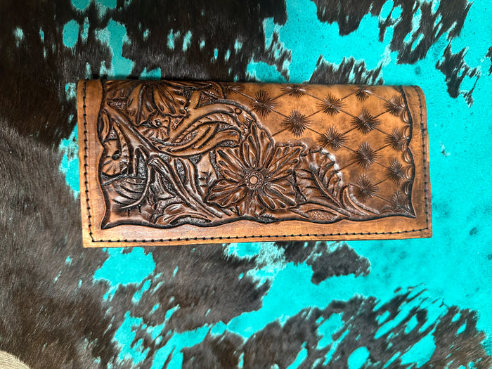 Hand tooled tally book.