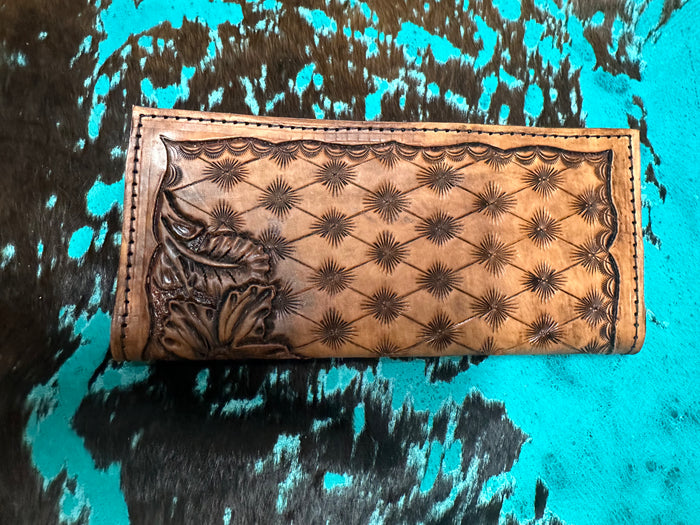 Hand tooled tally book.