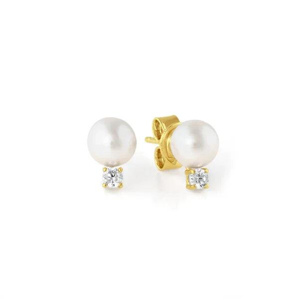 A pair of accented pearl stud earrings finished in 18kt yellow gold, with the pearls set in gold bands.