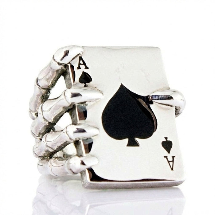 Front view of Ace of Spades ring featuring skeleton hand gripping playing card with black enamel spade