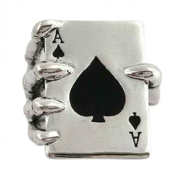 Detailed view of sterling silver skeleton fingers wrapped around Ace of Spades card face