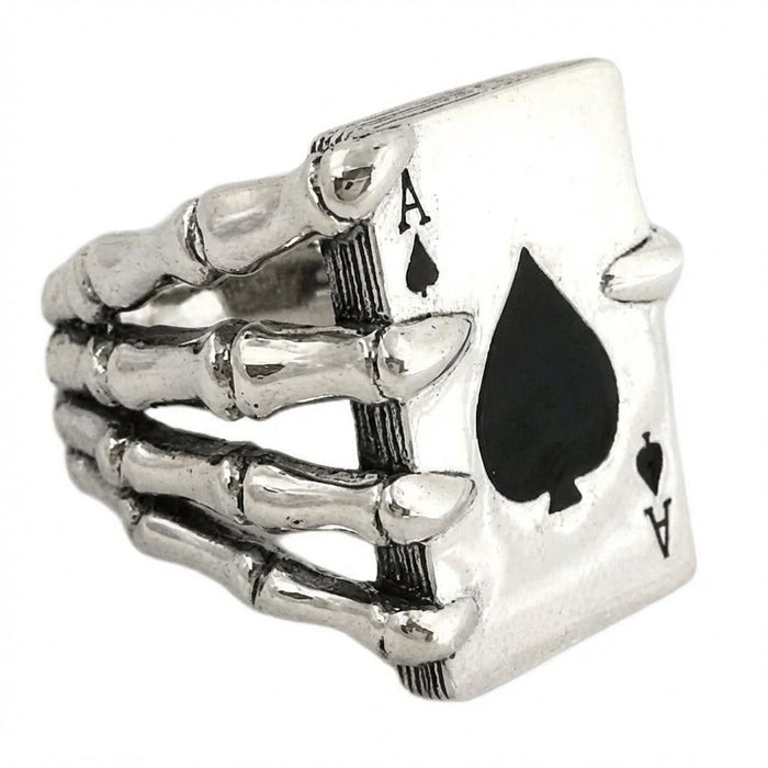 Side angle showing articulated skeleton hand bones and card depth on sterling silver ring