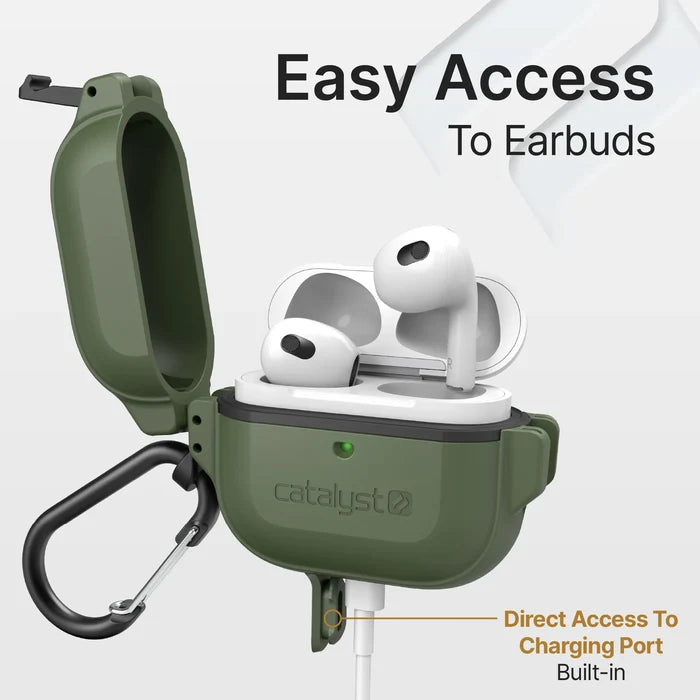 A green Catalyst Case US AirPods (Gen 3) 330ft Waterproof Total Protection Case + Carabiner holds white earbuds, its lid open for easy access. A charging cable is plugged in, showing direct port access.