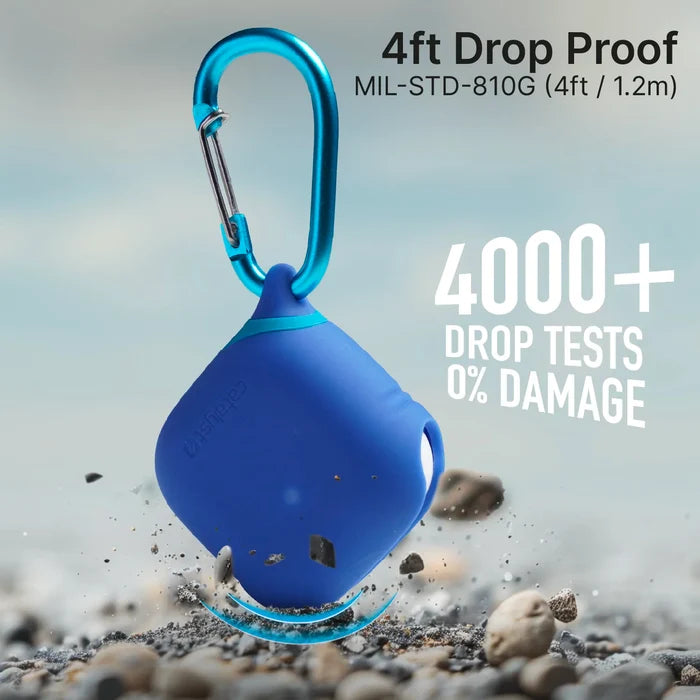 A Catalyst Case US AirPods (Gen 4) Waterproof Case + Carabiner floats above rocky ground, showcasing its durability with "4ft Drop Proof MIL-STD-810G (1.2m)" and "4000+ Drop Tests 0% Damage" shown on a blurred background.