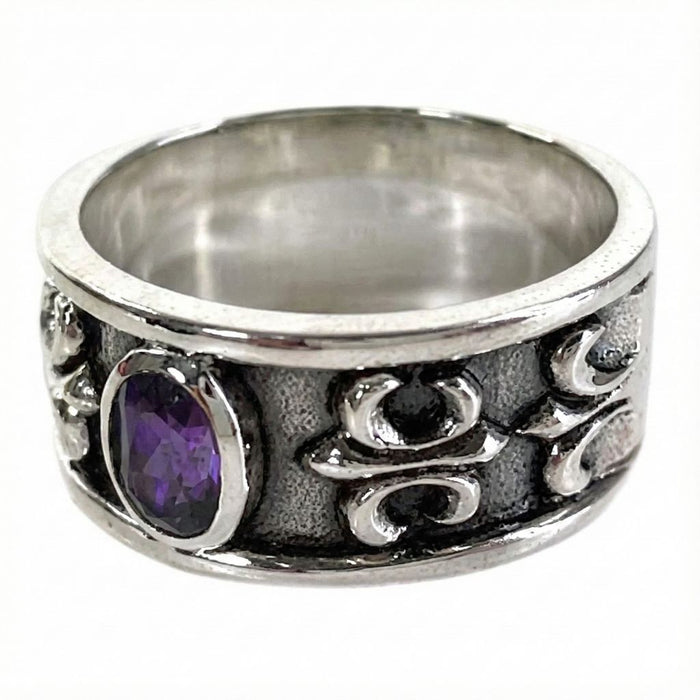 Side angle of the ring showing the intricate Fleur De Lis Gothic carving and oxidized finish