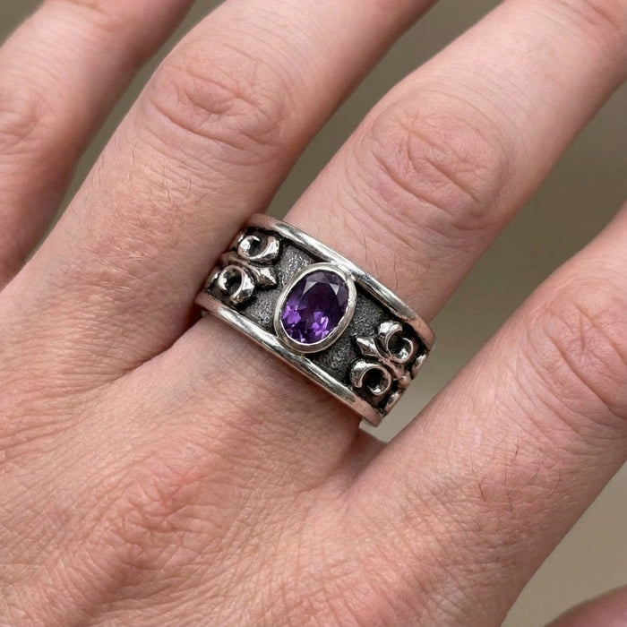 Model wearing the Amethyst Fleur De Lis ring to demonstrate width and fit on the hand