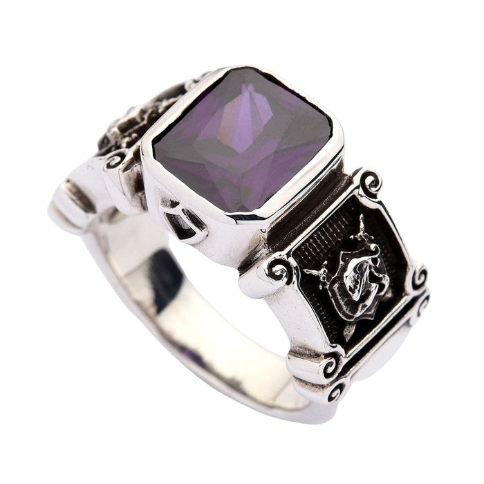 Angled view of the amethyst bishop-style ring highlighting the thick silver bezel and polished finish.