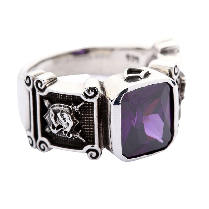 Detailed side view of the ring showing the heraldic shield and crossed swords carving.