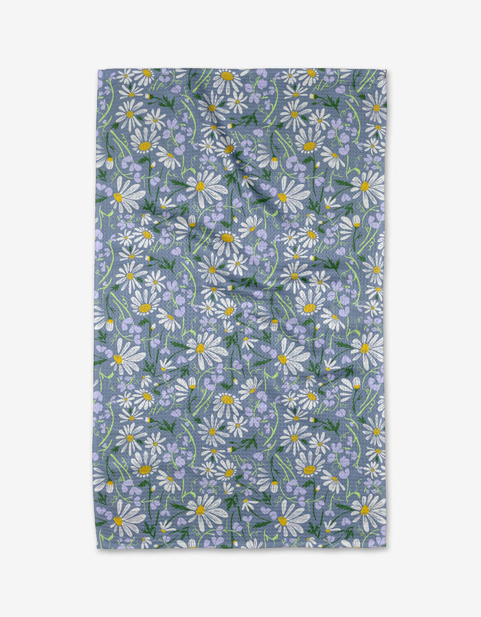A gray and white floral patterned tea towel with a hang loop.