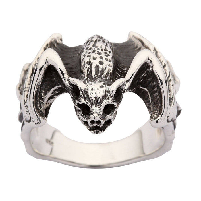 A direct front view of a gothic ring with a bat design, showing its snarling face and finely detailed wings.