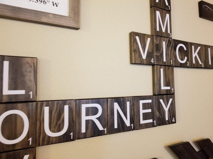 Oversized wooden Scrabble letters with beach and ocean theme.