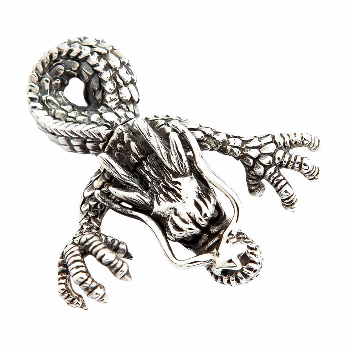 Top angle revealing the intricate scaly body, outstretched claws, and oxidized silver finish of the dragon pendant.