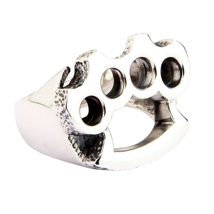 Three-quarter view of polished biker knuckle duster ring in sterling silver