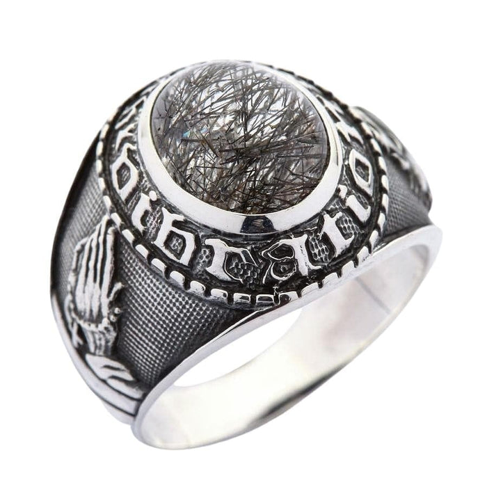Sterling silver ring with praying hands carving and black rutilated quartz gemstone side angle
