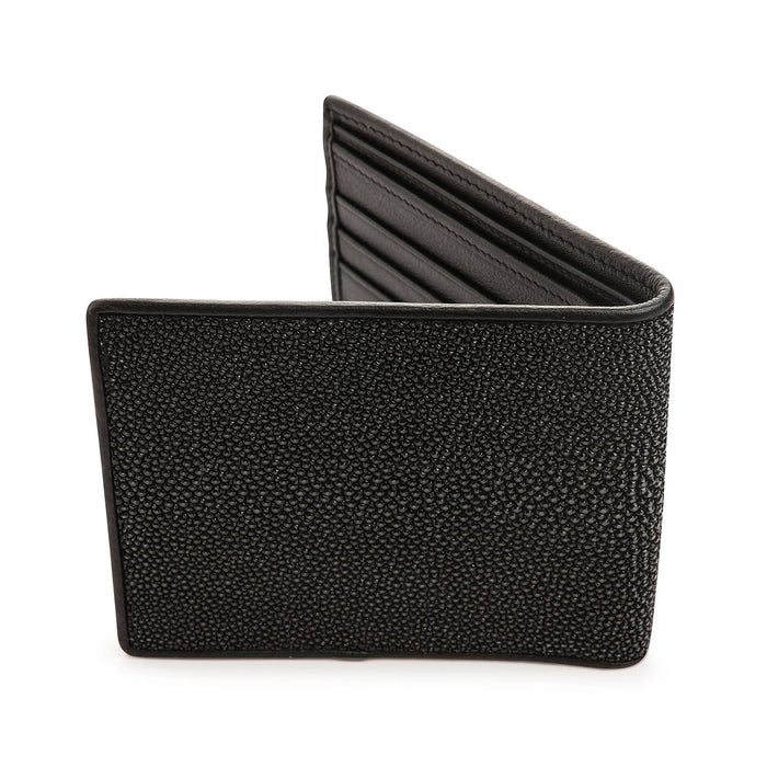 Standing black stingray bifold wallet showing the beaded polished exterior and a vertical white pearl marking.