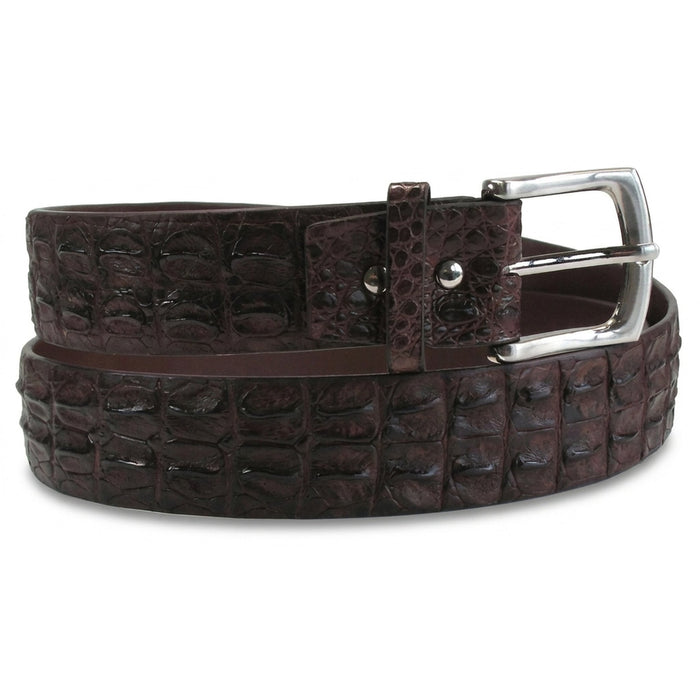 Close view of the leather keeper loop and twin rivets beside the polished silver prong buckle on the crocodile belt
