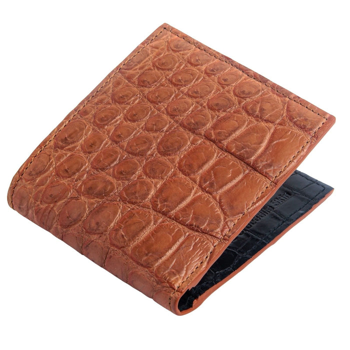 An angled view of the brown crocodile wallet showing the two-tone design with a black interior.