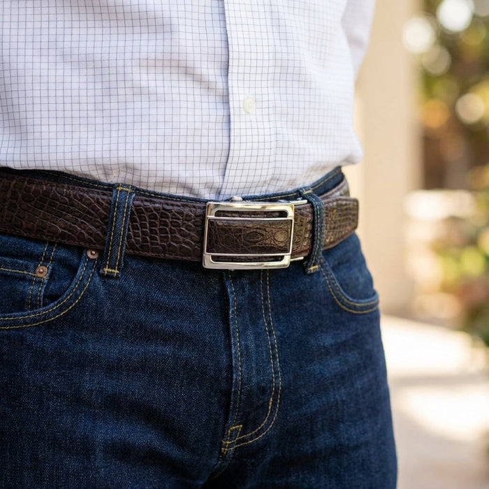 Men's burgundy crocodile leather belt styled with dark jeans and white shirt