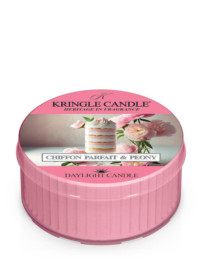 Pink candle tin labeled "Kringle Candle, Chiffon Parfait & Peony," with an image of a cake and peonies on the lid.