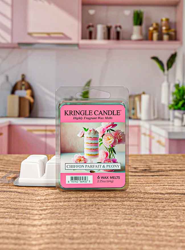 Pink kitchen with Kringle Candle wax melts in Chiffon Parfait & Peony scent on the counter. Wax cubes are visible.