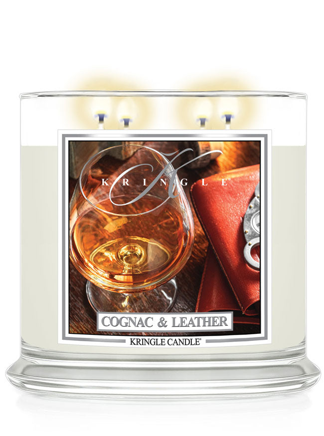 Cognac and leather scented lit 4-wick lit candle by Kringle Candle