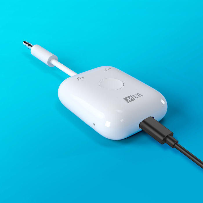 White Connect Air plugged into a  Charging cable on a blue background