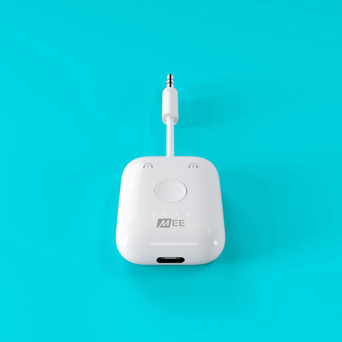 White Connect Air Wireless Bluetooth Adapter Transmitter for inflight entertainment systems on airplane on a blue background