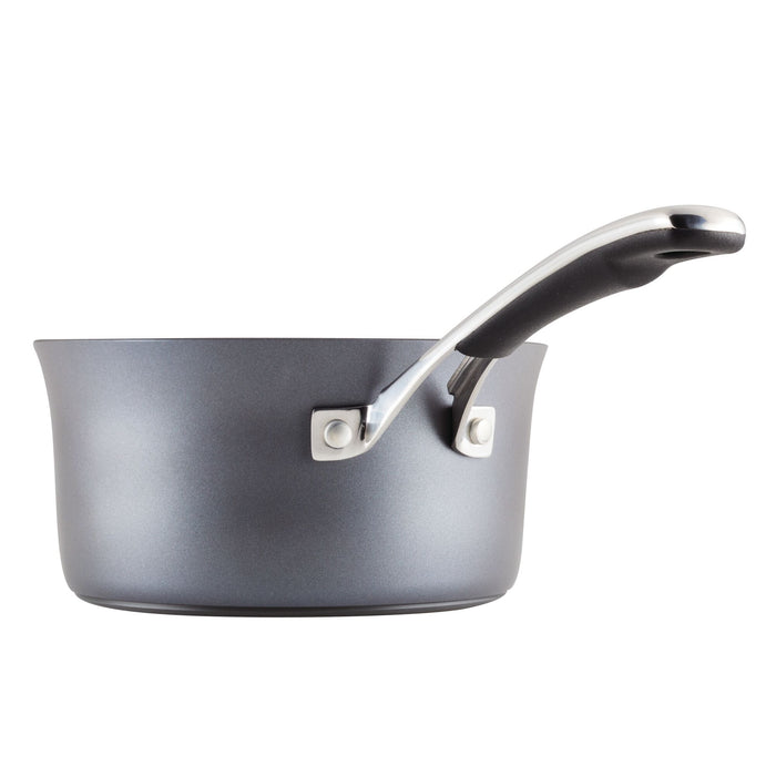 Introducing the Cook + Create Hard Anodized Nonstick Saucepan, featuring a sleek gray finish and a long handle. Crafted from hard-anodized aluminum, it offers superior durability and even heat distribution.