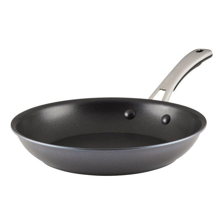 The Cook + Create Hard Anodized Nonstick Frying Pan is designed with hard-anodized aluminum, showcasing a durable triple-layer nonstick surface and an elegant metal handle, all highlighted against a pristine white backdrop.
