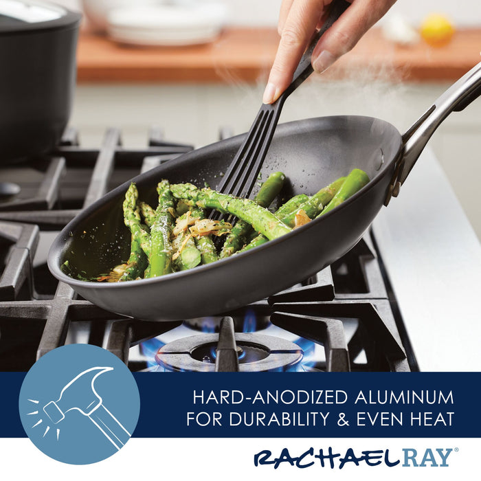 Cooking asparagus in the Cook + Create Hard Anodized Nonstick Frying Pan on a gas stove with a black spatula, the hard-anodized aluminum ensures even heat distribution while the triple-layer nonstick surface makes for an effortless cleanup.